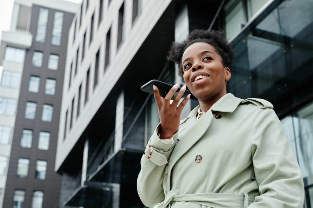 woman holding a phone while talking