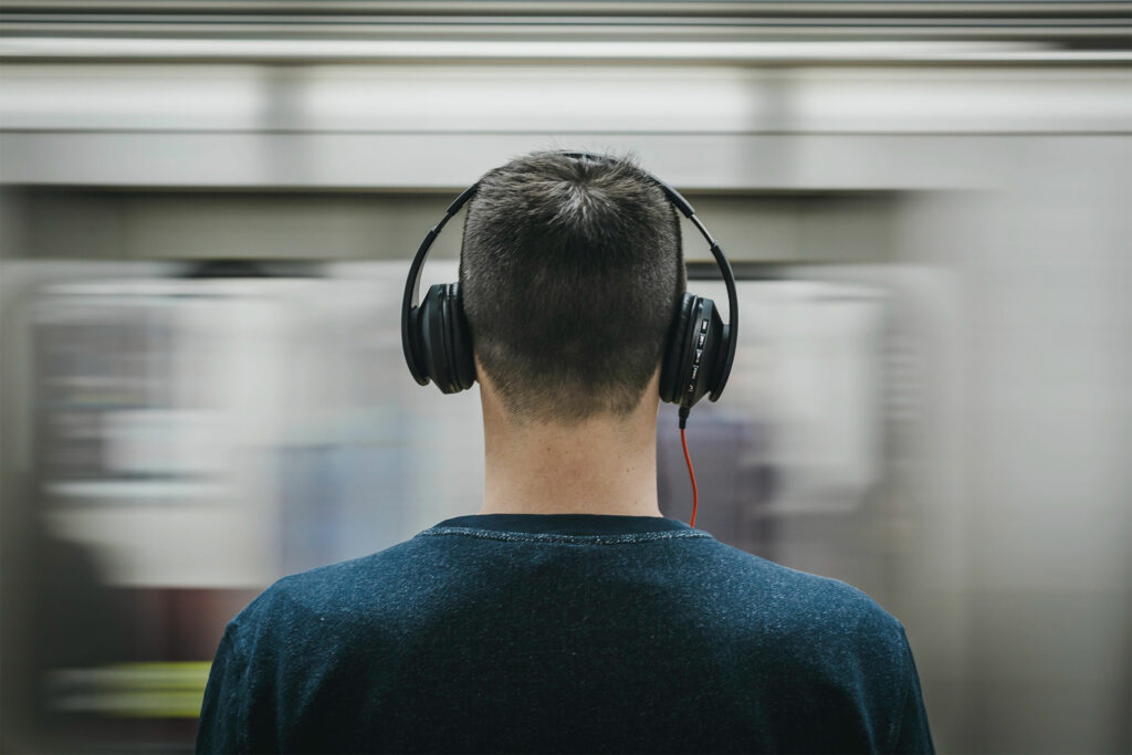 Man listens to download music on phone