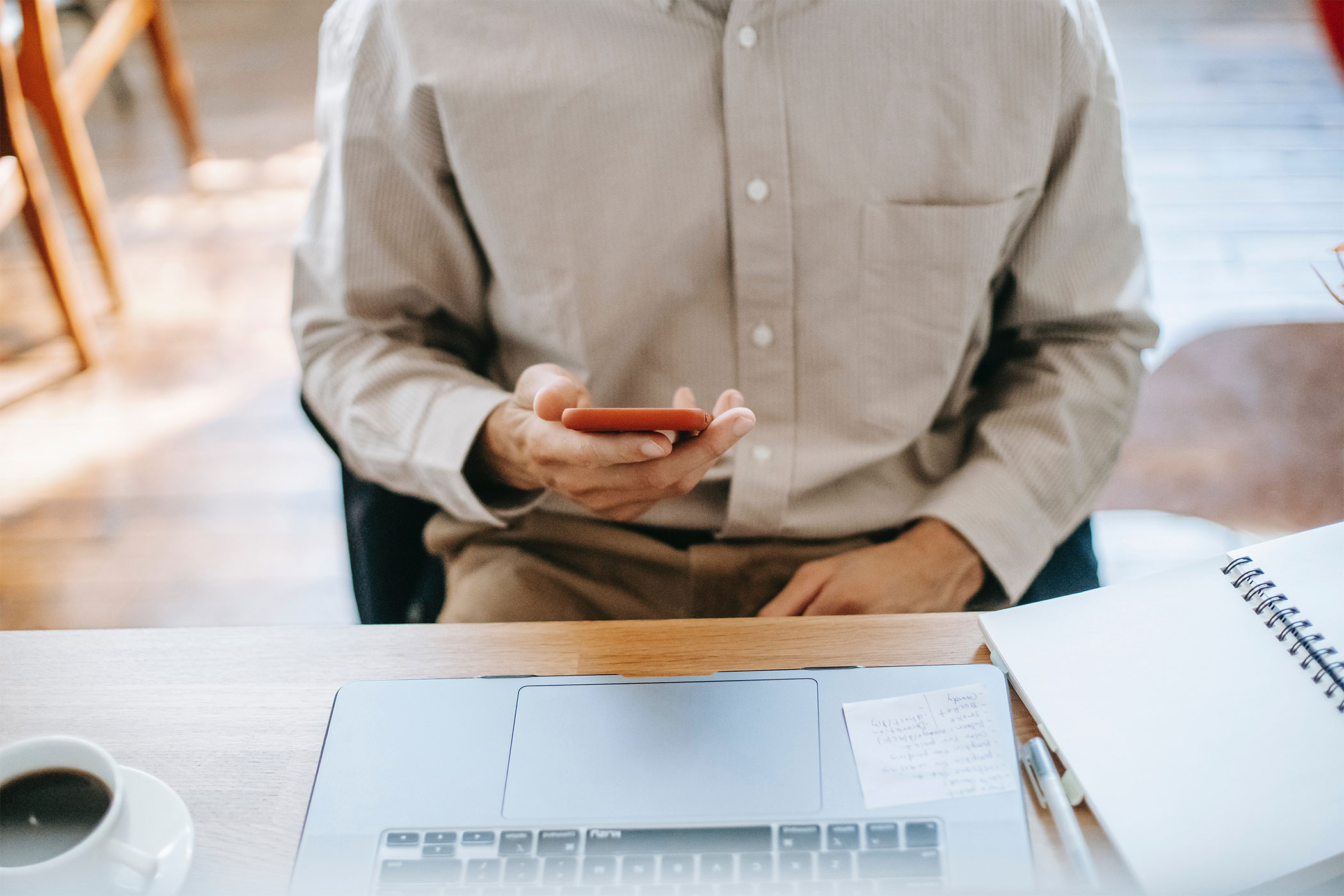 man editing resume on phone